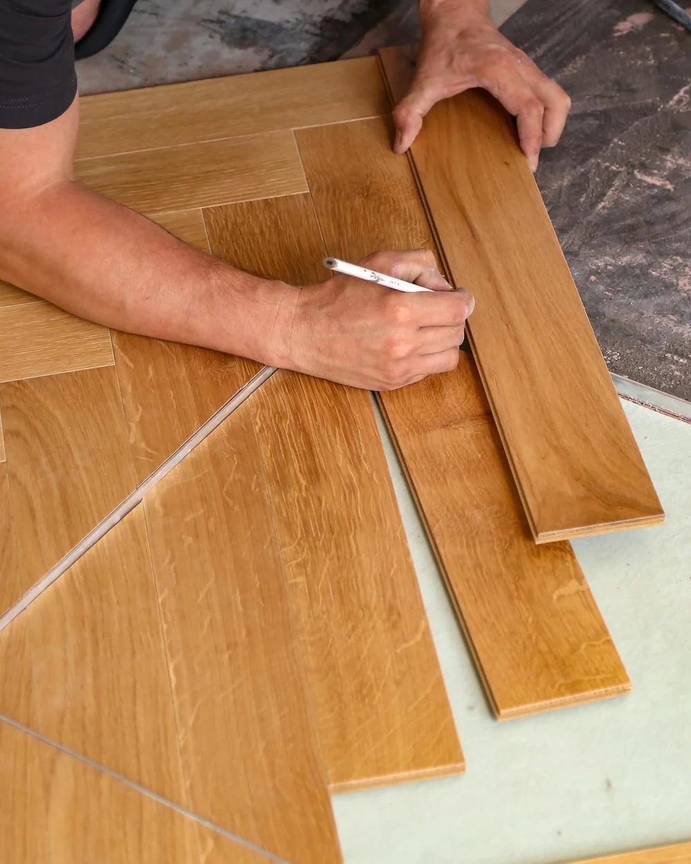 Floating timber flooring being installed